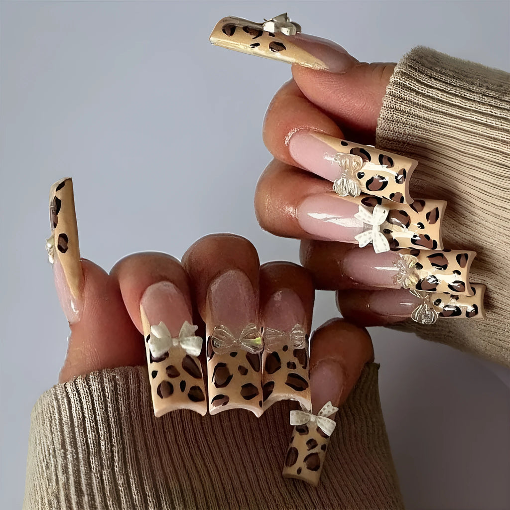 Leopard print false nail art kit with plastic butterfly decorations in colour WM296.