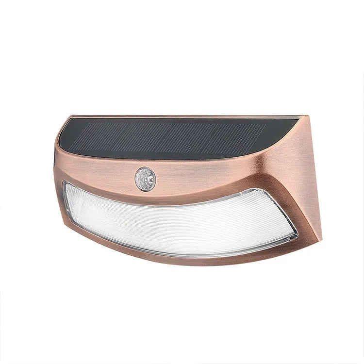 Solar-powered retro decorative wall lamp with smiling face design for garden lighting