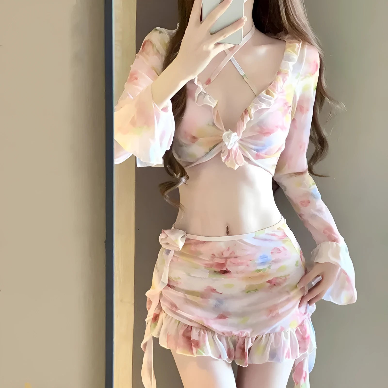 Cherry blossom pink women's floral bikini swimsuit laid flat