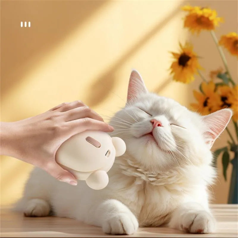 Pink rechargeable pet grooming brush with spray bottle attachment and removable silicone comb head