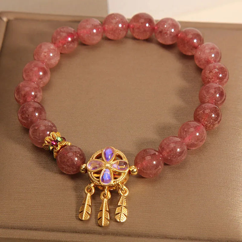 Women's strawberry quartz crystal bracelet with four-leaf dream catcher ball pendant
