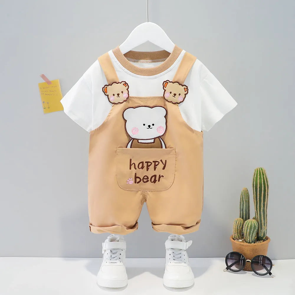 Baby wearing yellow cotton summer overalls with cartoon pattern and front buttons