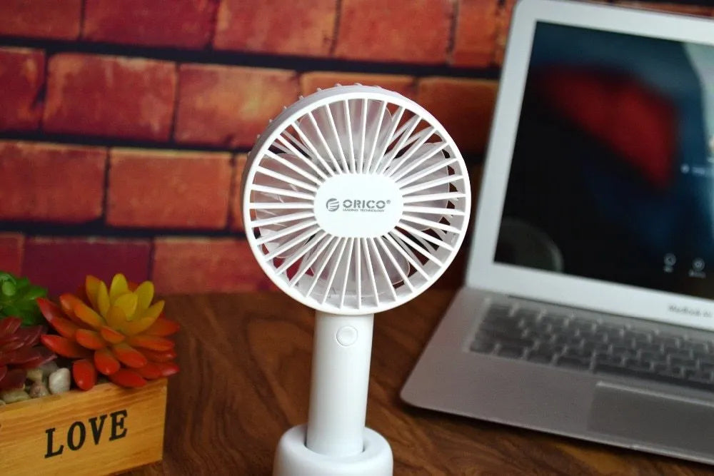 White ORICO FH1 USB rechargeable portable fan with fine line details on desktop