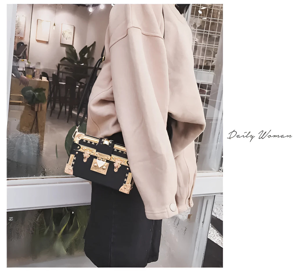 Women's hard PU shoulder bag with flap closure and single adjustable strap in black or green