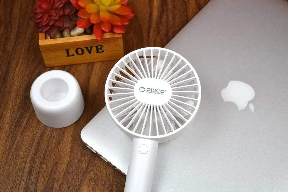 White ORICO FH1 USB rechargeable portable fan with fine line details on desktop