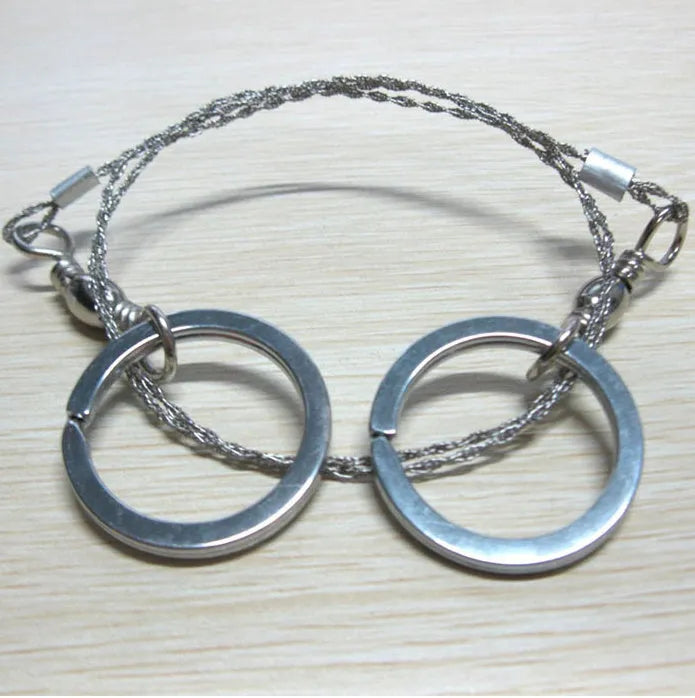 Stainless steel survival wire saw with thumb rings measuring 55cm cutting length