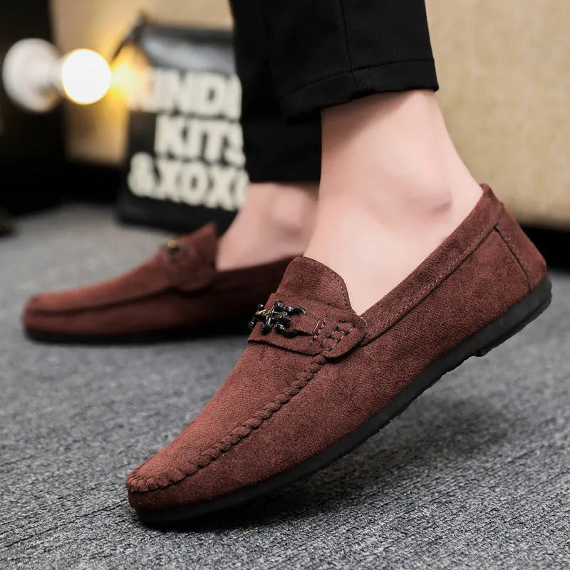 Men's black and brown waterproof slip-on loafers with round toe and low heel on a white background.