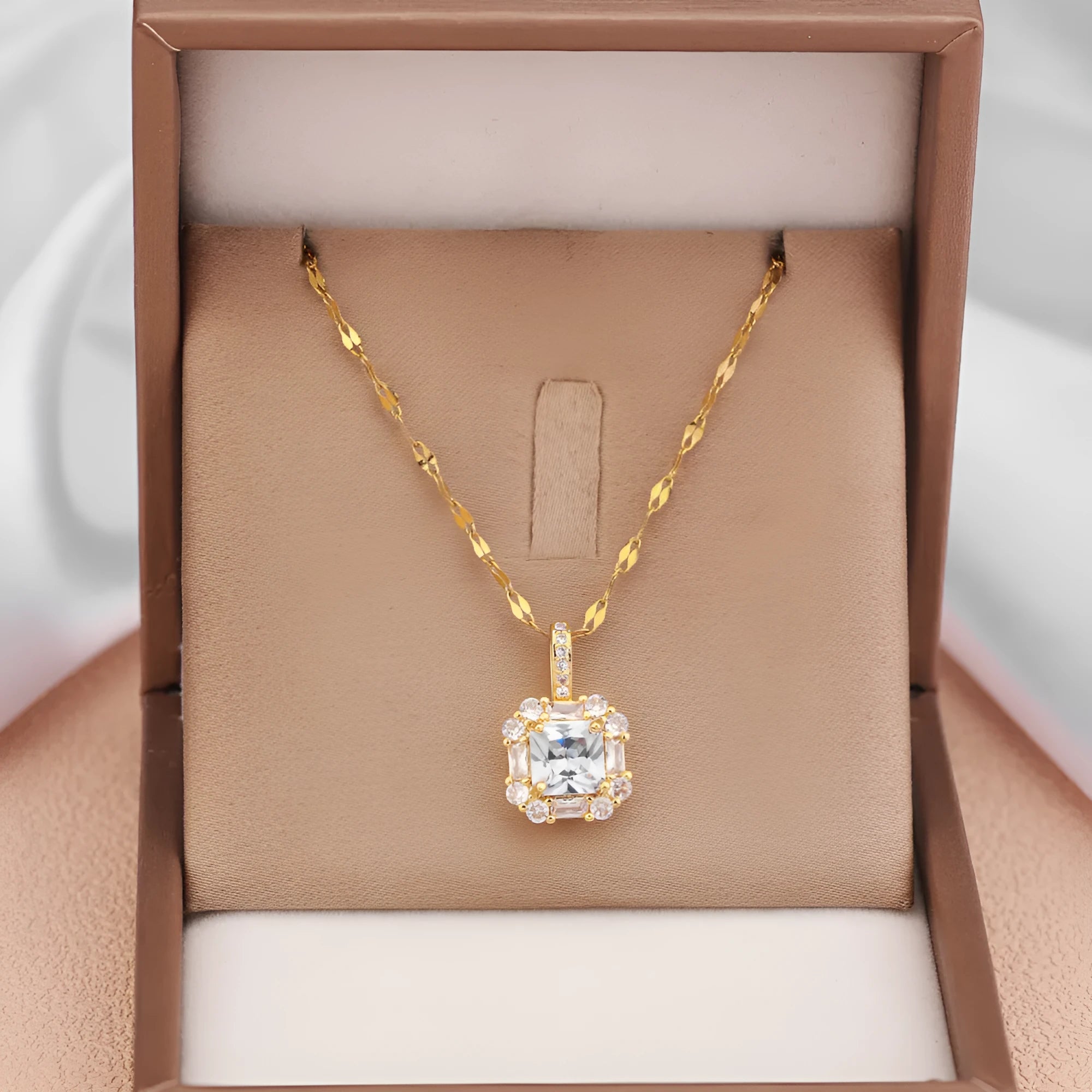 Gold titanium steel necklace with geometric quadrilateral pendant featuring mixed gemstone inlay on water wave chain