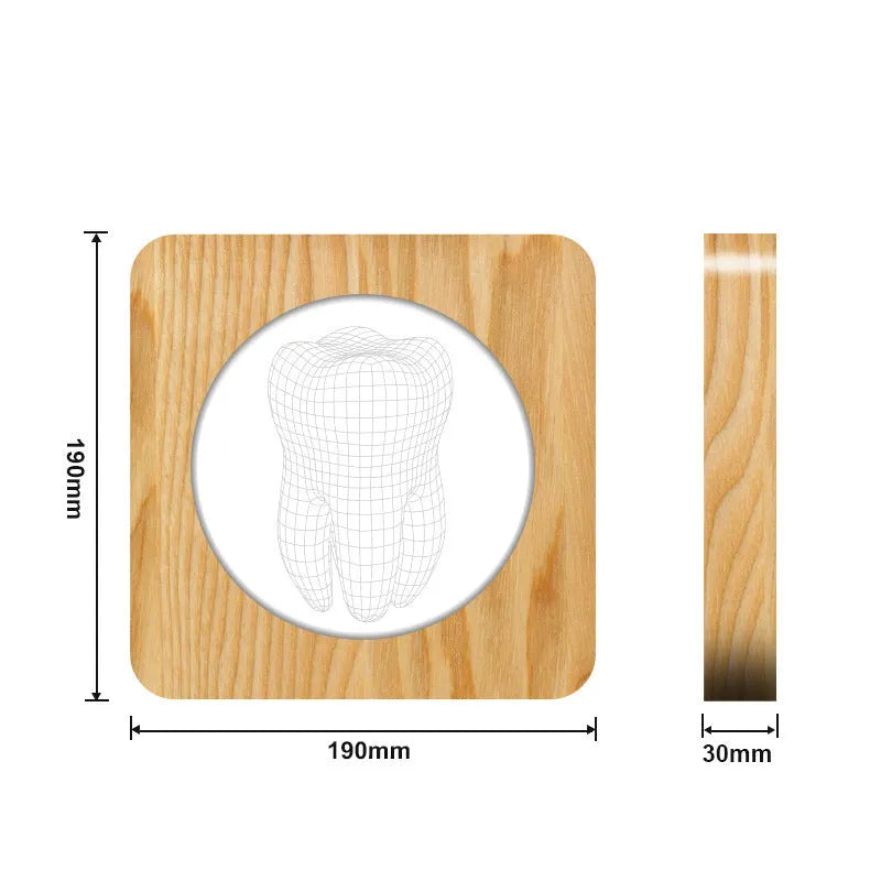 Tooth-shaped wooden colour acrylic USB night lamp on a table