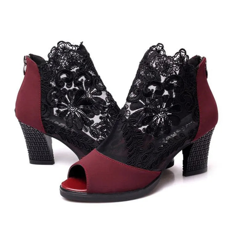 Women's black gladiator sandals with flower lace detailing, square heels, and zip closure