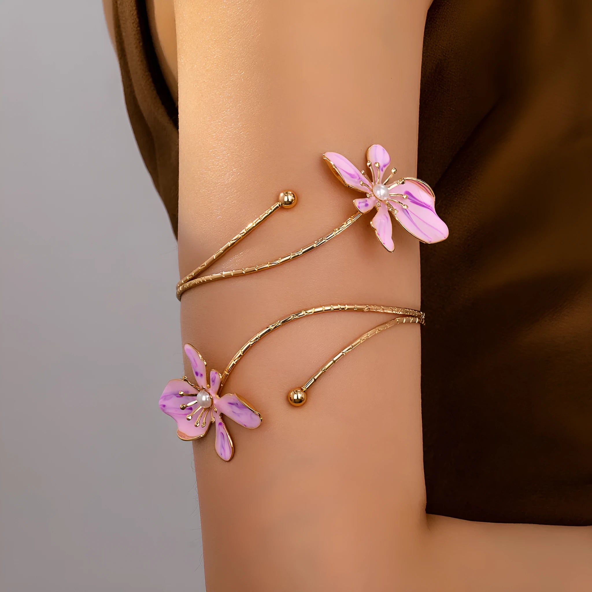Pink and purple alloy armband bracelet with hollow patterned designs and detailed lines