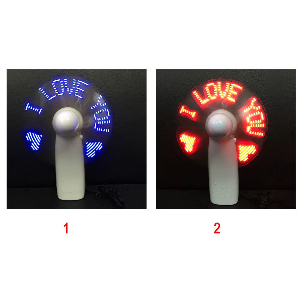 White handheld mini fan with LED love heart pattern display showing blue and red colours