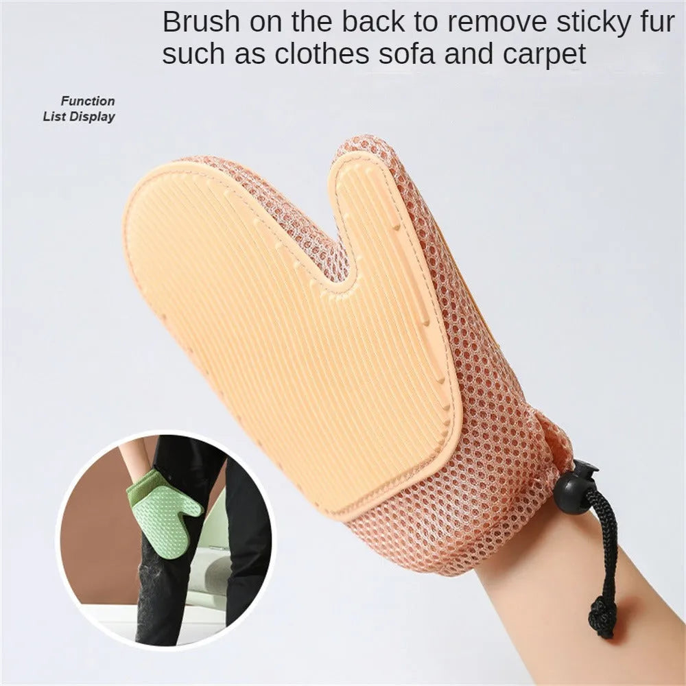 A dark blue mesh pet grooming glove for removing hair from dogs and cats.