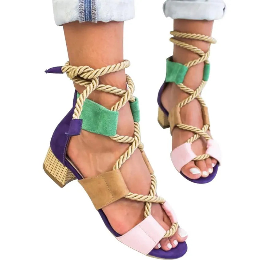 Women's beige suede sandals with thick mid-heel, front strap, and fish-mouth toe.
