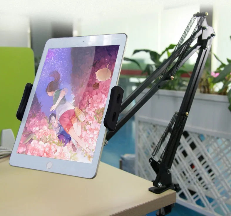 Black and white adjustable phone and tablet stand on desktop showing viewing angle