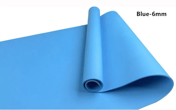 Red EVA fitness yoga mat with 6mm thickness on a wooden floor.