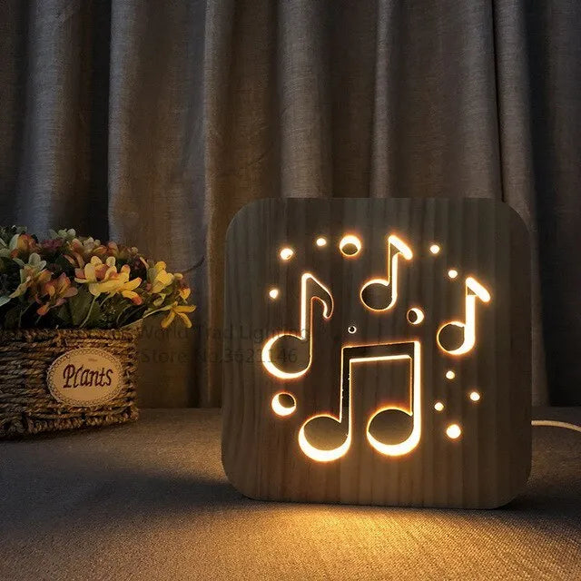 Pine wood cube LED lamp with warm white light, showing USB cable connection