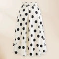 Women's black one-piece swimsuit with white round skirt and bow detail for swimming