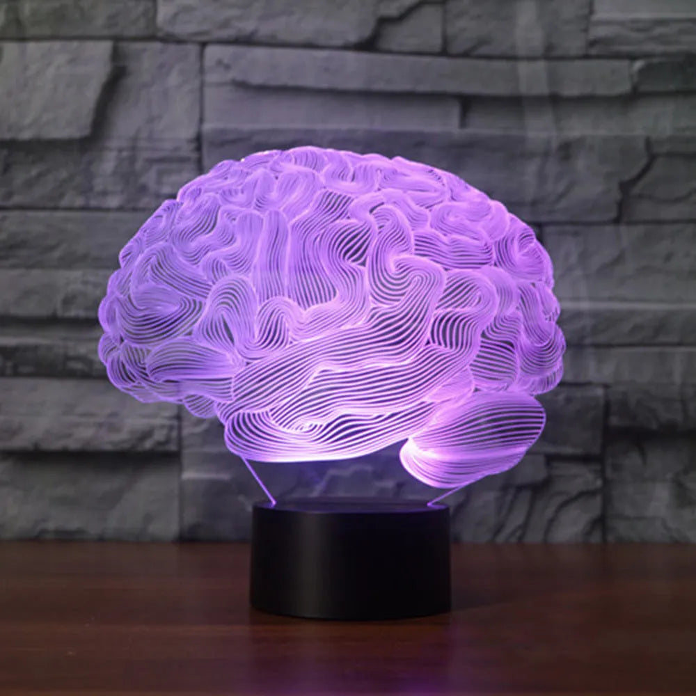 3D acrylic brain illusion LED desk lamp with colour changing remote control on wooden desk