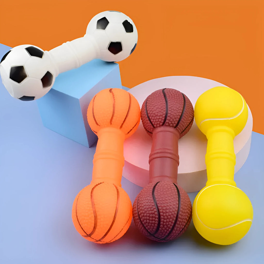 Brown, orange, white, and yellow PVC football dumbbell shaped dog squeaky toy on a white background.