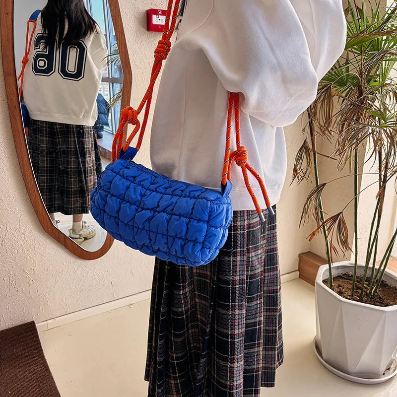 Women's lightweight nylon pillow-shaped messenger bag with rhombus pattern in chosen colour.