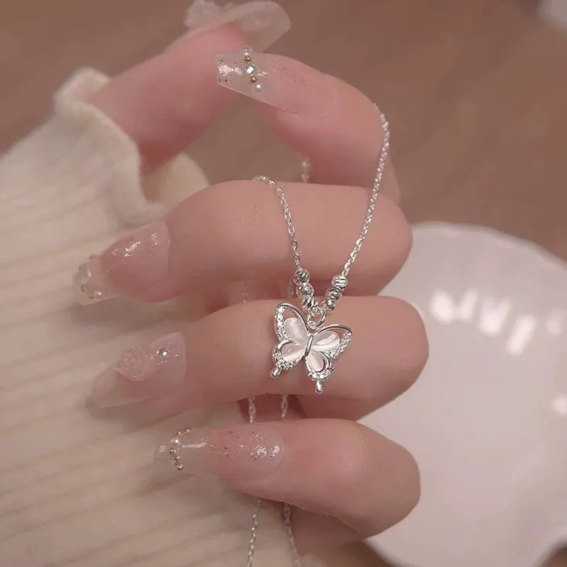 Silver opal butterfly pendant necklace on a cross chain, adjustable 41-50cm, made of 925 sterling silver.