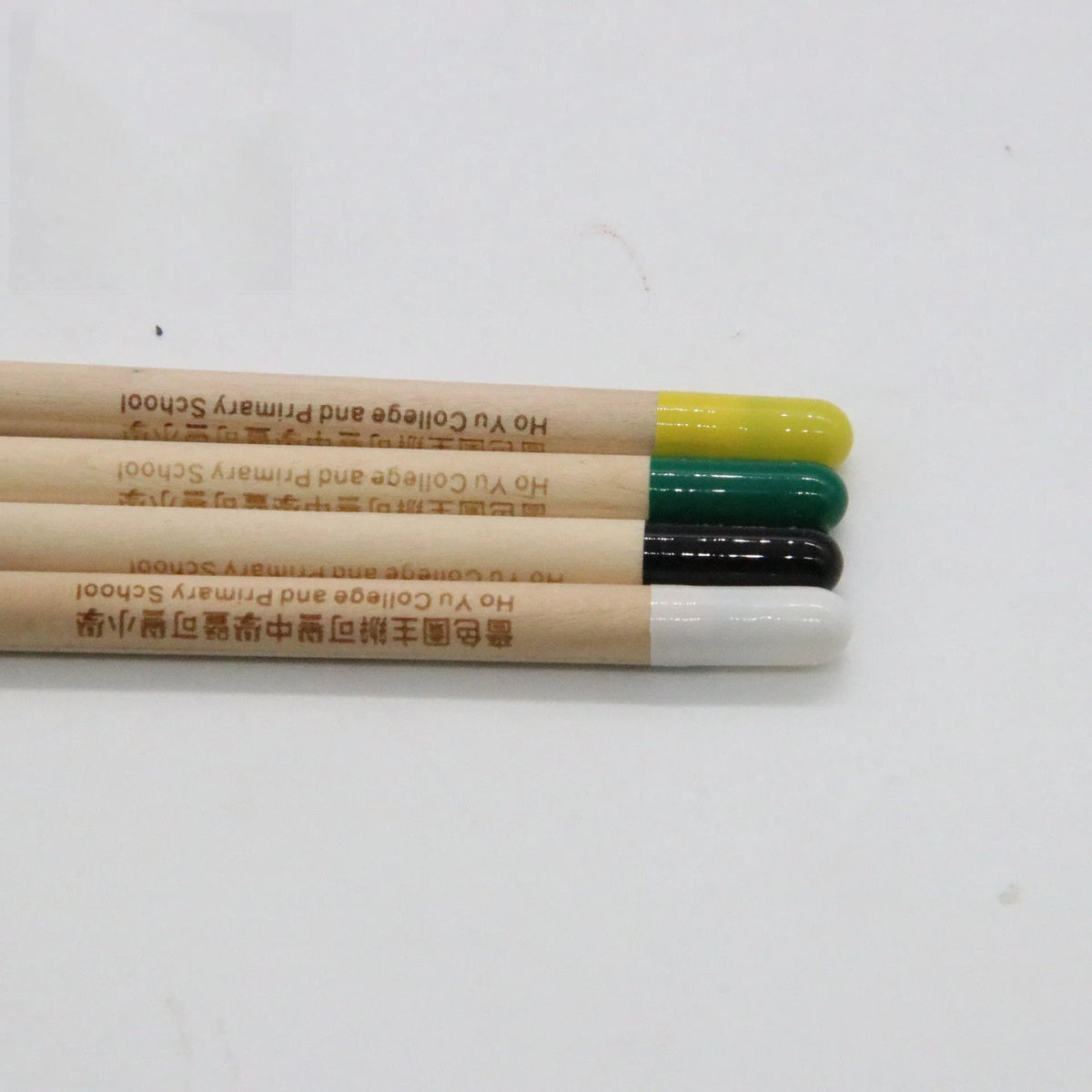 Seed pencil with biodegradable capsule containing plant seeds in various colours alongside HB hardness designation