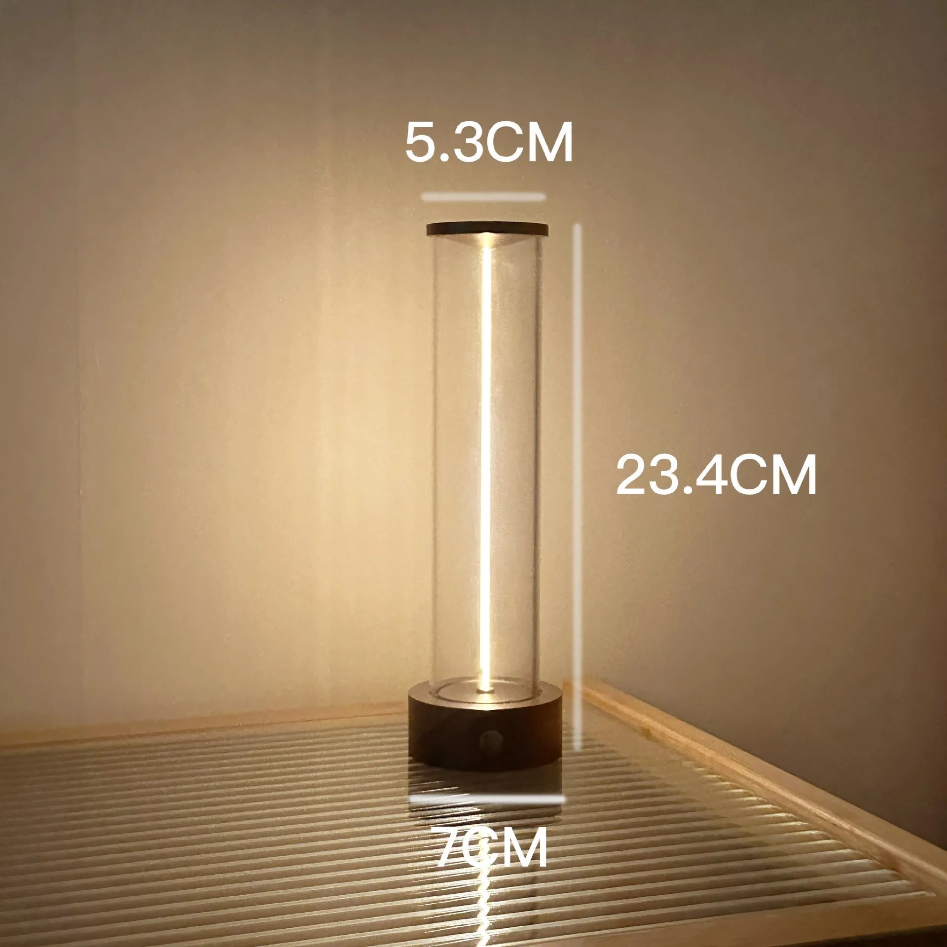 Modern glass LED light strip with magnetic back, measuring 234mm high, on a metal surface.