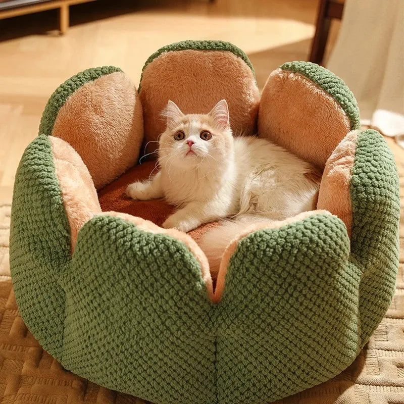 Green cactus petal shaped enclosed plush bed for a cat or small dog on a hardwood floor.