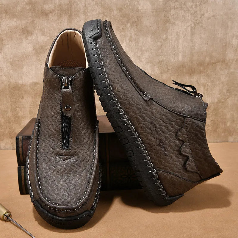 Men's black slip-on leather loafers with round toe and flat rubber sole