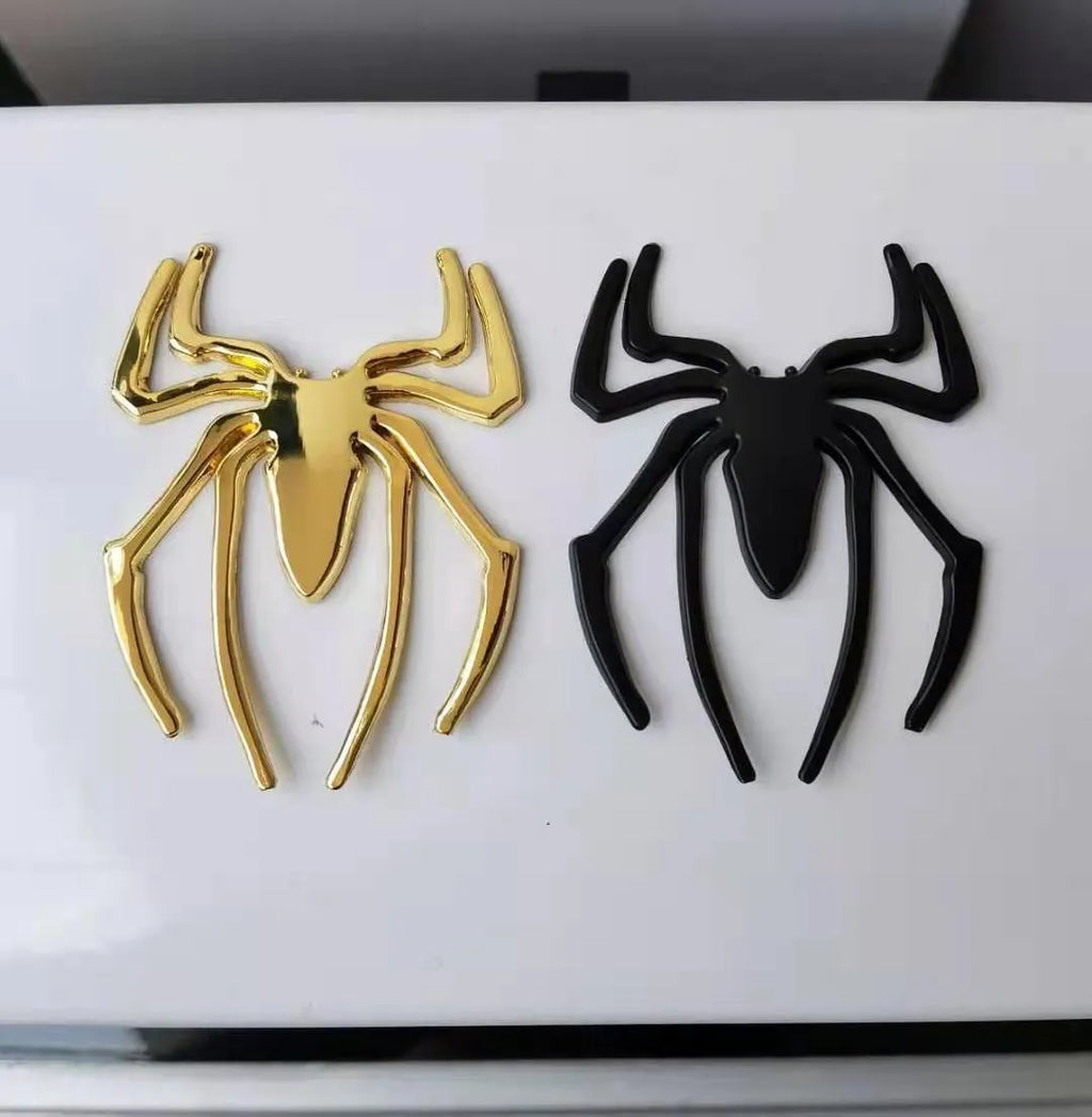 Three-dimensional metal spider car sticker in gold, silver, black, or red.