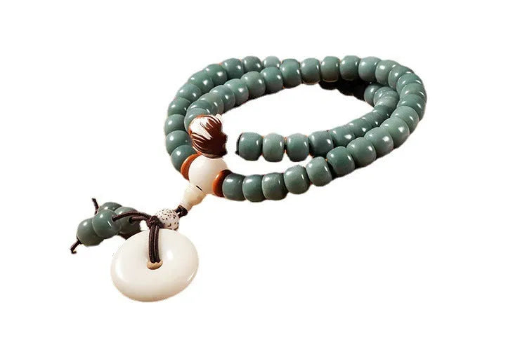White Jade Bodhi Green Sandalwood beaded bracelet with a double ring clasp.