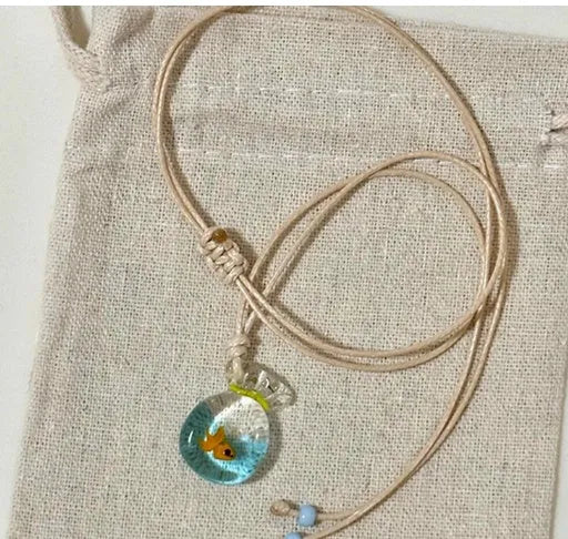 Women's necklace with a coloured glaze joker skirt pendant on a cotton and linen clavicle chain.