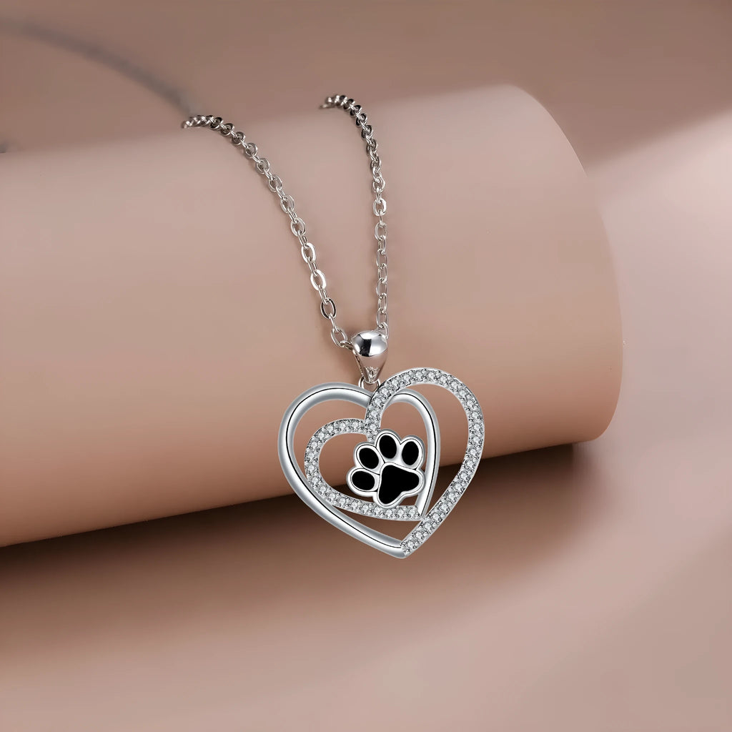 Gold colour dog paw print and heart necklace on cross chain for women