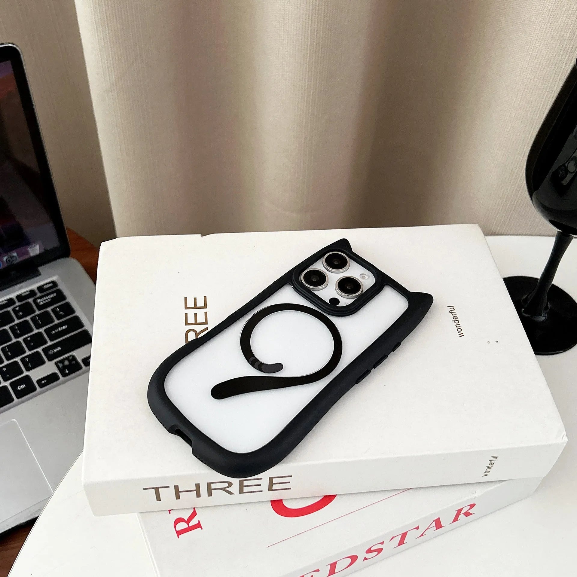 Transparent acrylic TPU phone case for iPhone 17 series in black colour, showing magnetic ring feature.