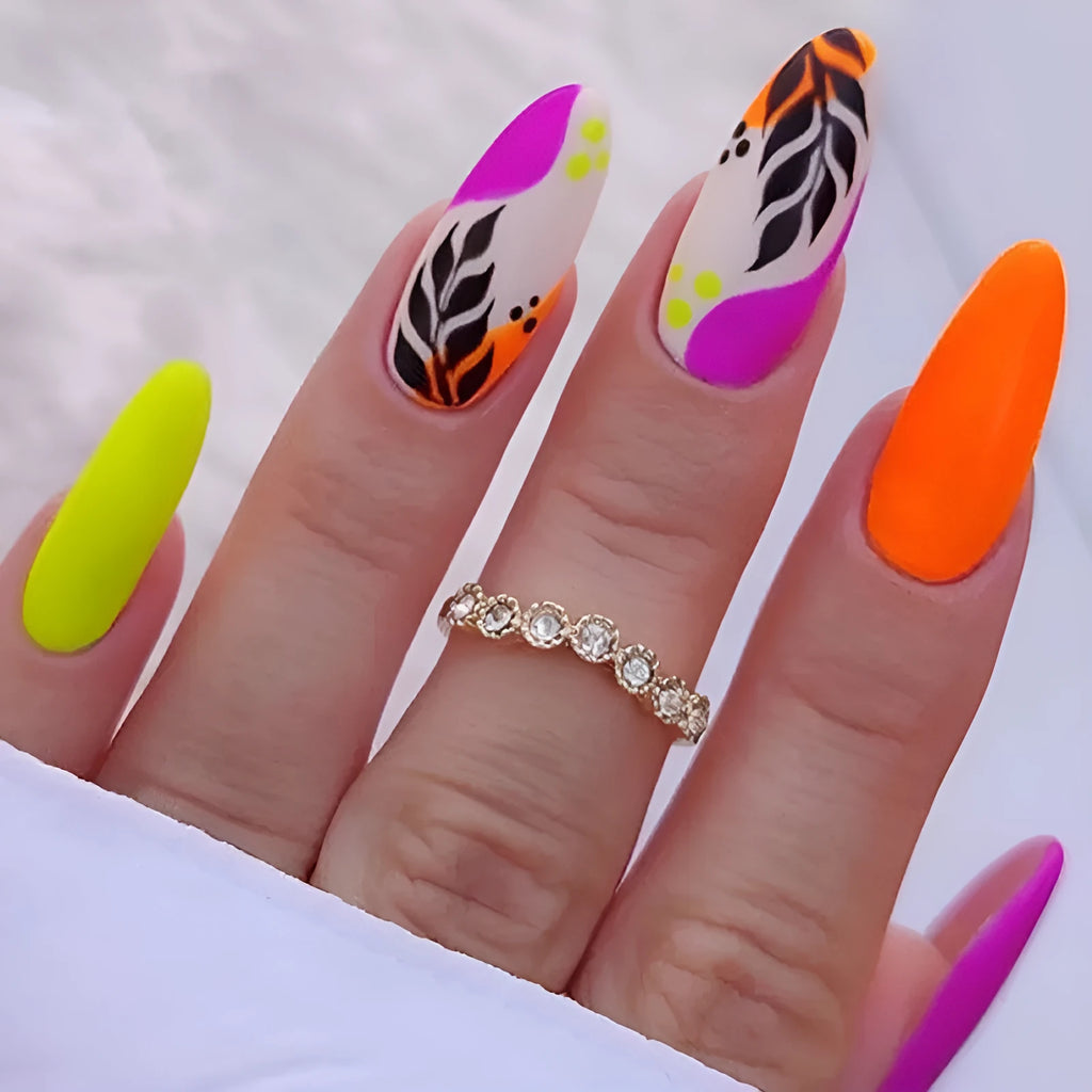 Wear Armour medium almond frosted nail stickers showing four designs: French leaves, plating, macarons, and leopard print