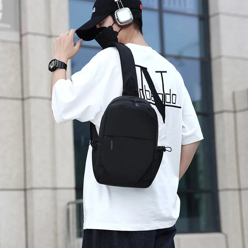 Men's grey lightweight waterproof chest bag with shoulder strap showing front compartment.