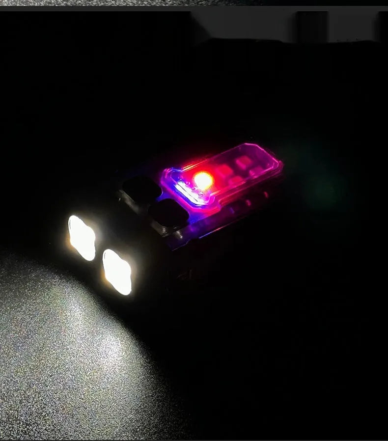 Portable tactical mini warning flashlight with USB charging cable attached for backpack mounting