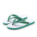 Rubber beach flip-flops in black with a white fish label on the strap, showing non-slip tread pattern.