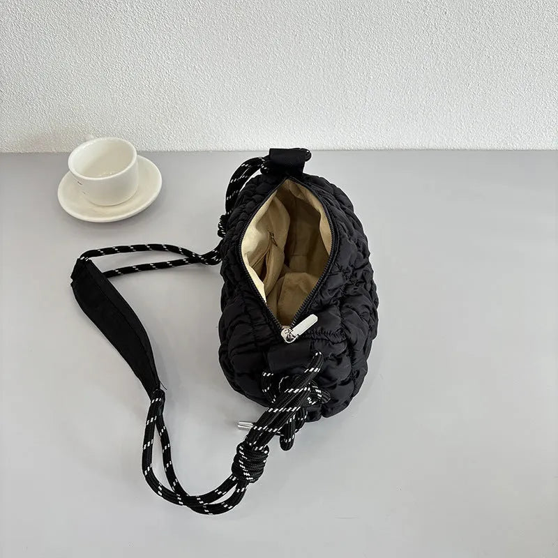 Women's lightweight nylon pillow-shaped messenger bag with rhombus pattern in chosen colour.