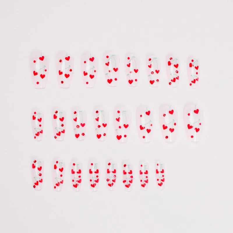 Set of 24 cherry blossom French manicure press-on nails with red diamond accents and glue tube