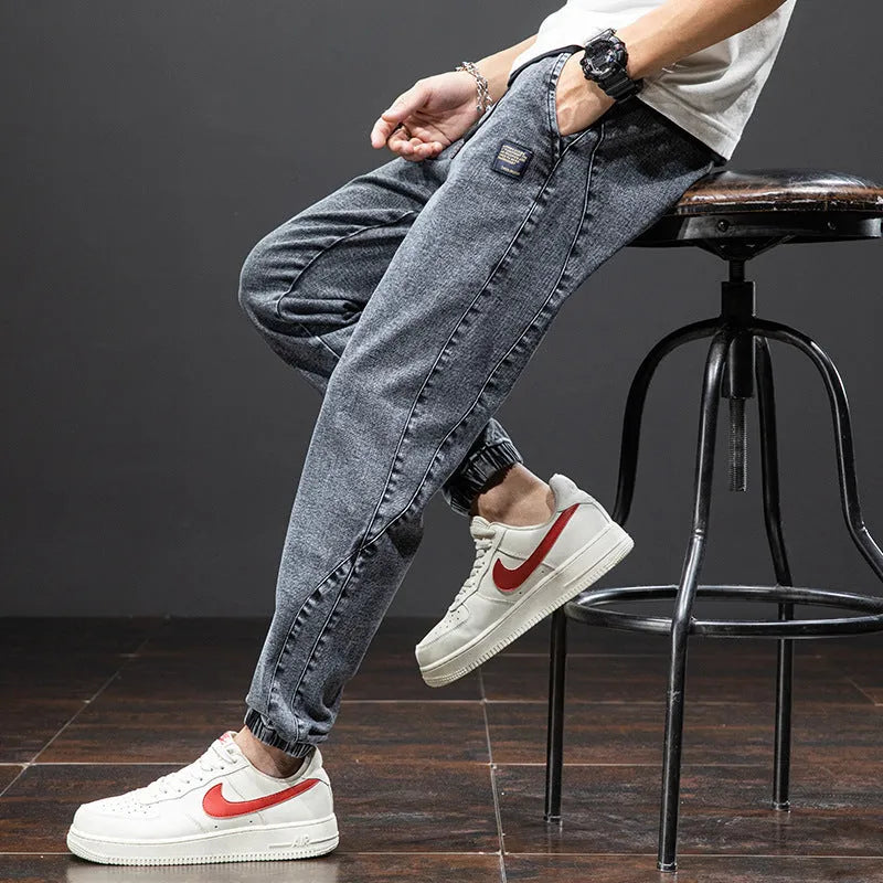 Men's loose fit cargo jeans in blue with straight leg and front pockets.
