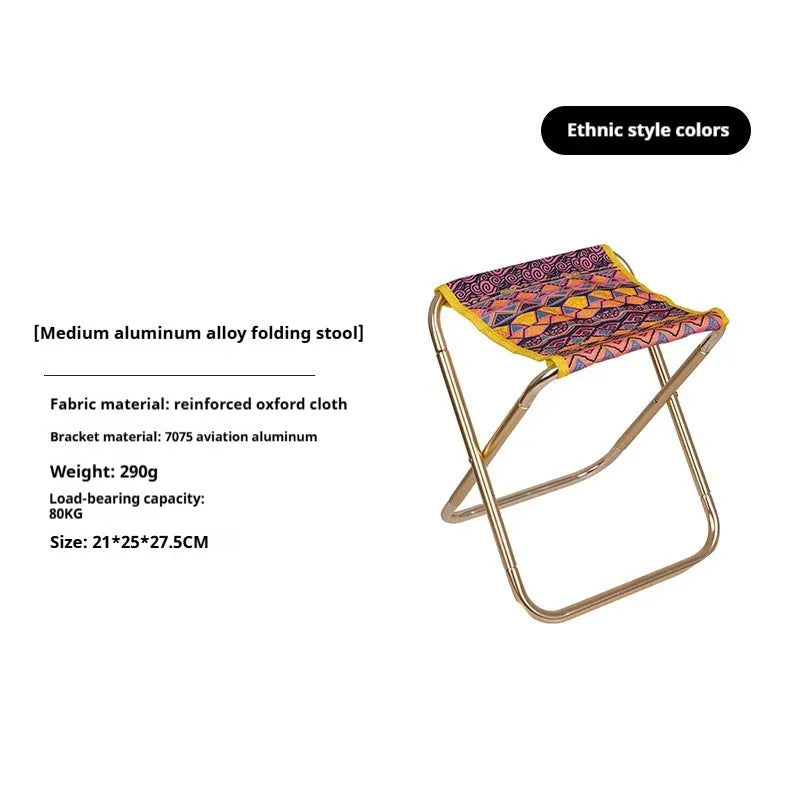 Black aluminium alloy folding stool shown in a folded position for portable storage.