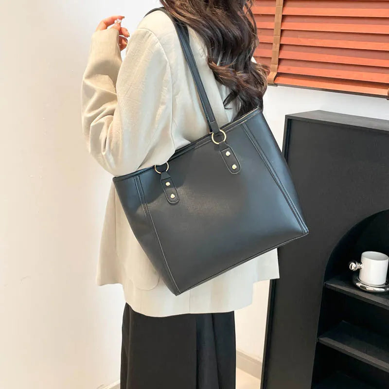 Contrast colour PU leather tote bag showing internal organisation compartments and external slit pocket