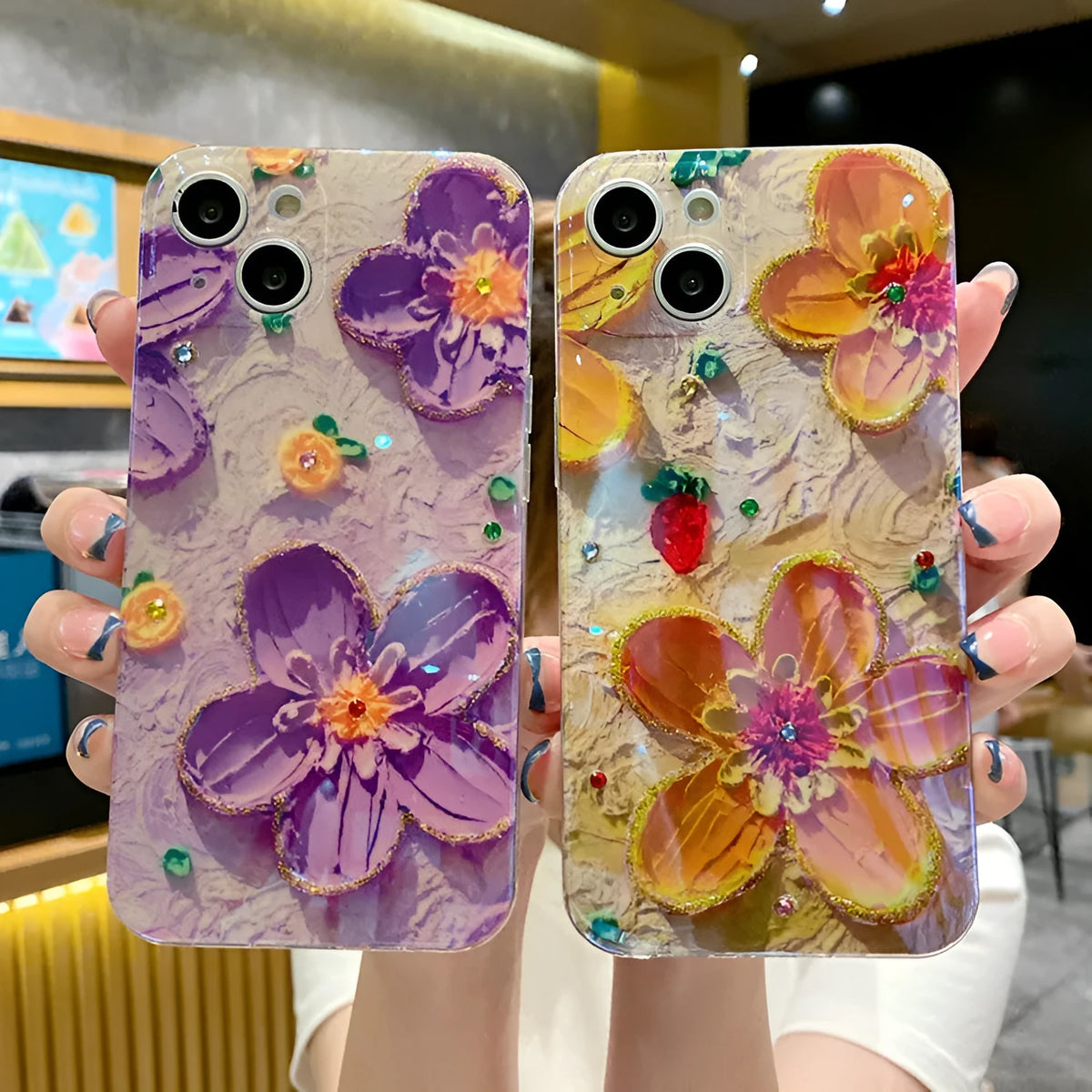 Purple and yellow soft rubber phone cases with ornate oil painting flower design and blue inlays.