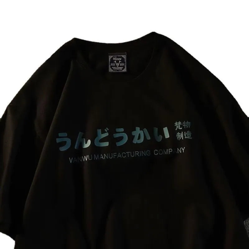 A black loose-fit cotton short sleeve t-shirt with a letter pattern, shown flat.