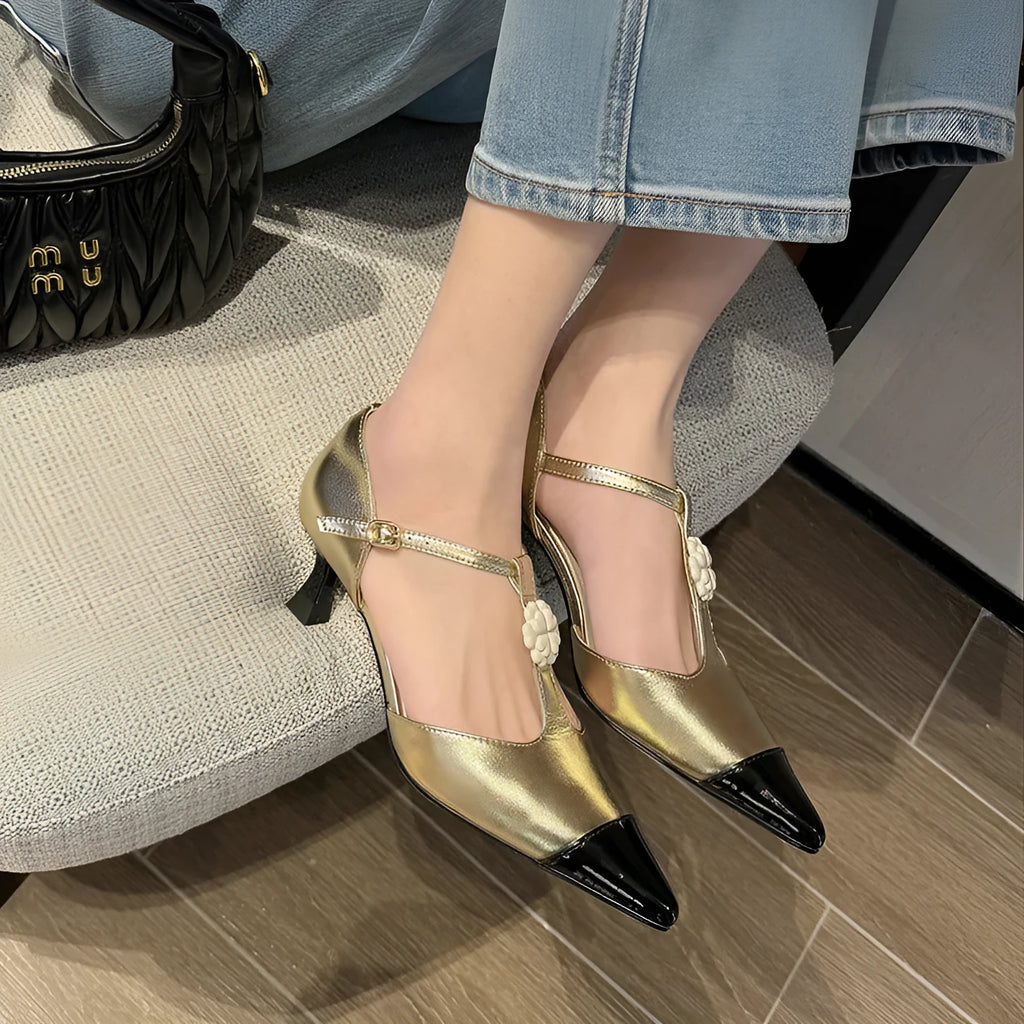 Women's gold stiletto shoe with flower buckle decoration and pointed toe design on sheepskin upper