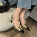 Women's gold stiletto shoe with flower buckle decoration and pointed toe design on sheepskin upper