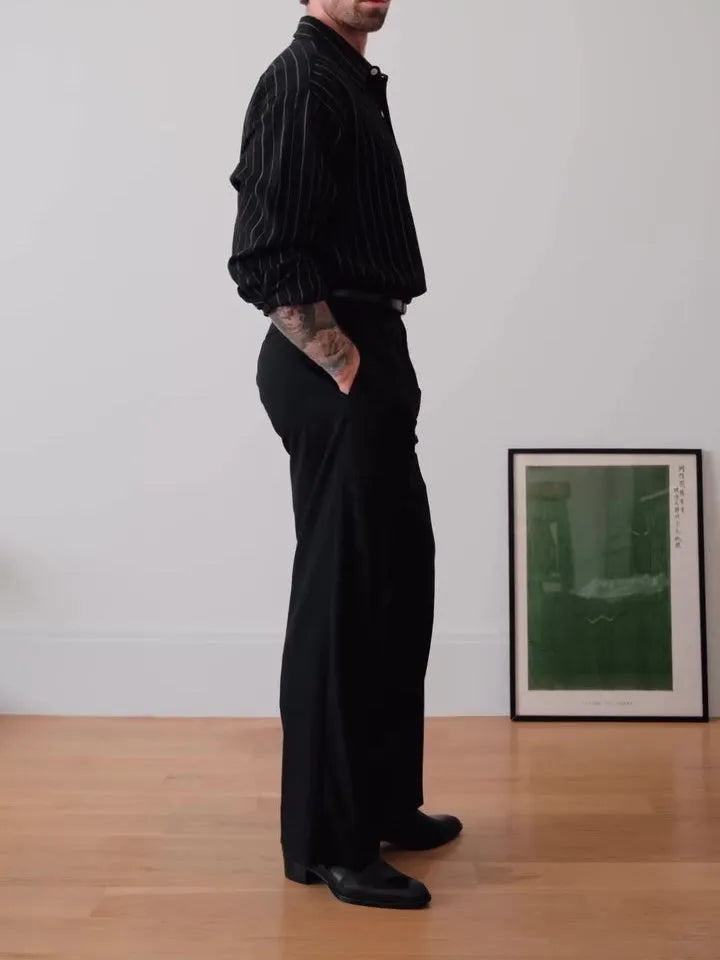 Men's black pinstriped button-down shirt with a regular fit collar on a hanger.