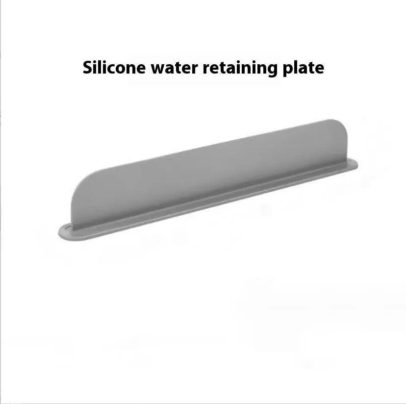 Thick grey silicone sink water blocking plate splash guard shown on a kitchen sink edge